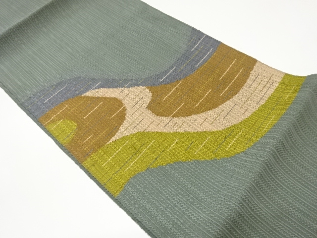 Nagoya obi woven with a running water pattern